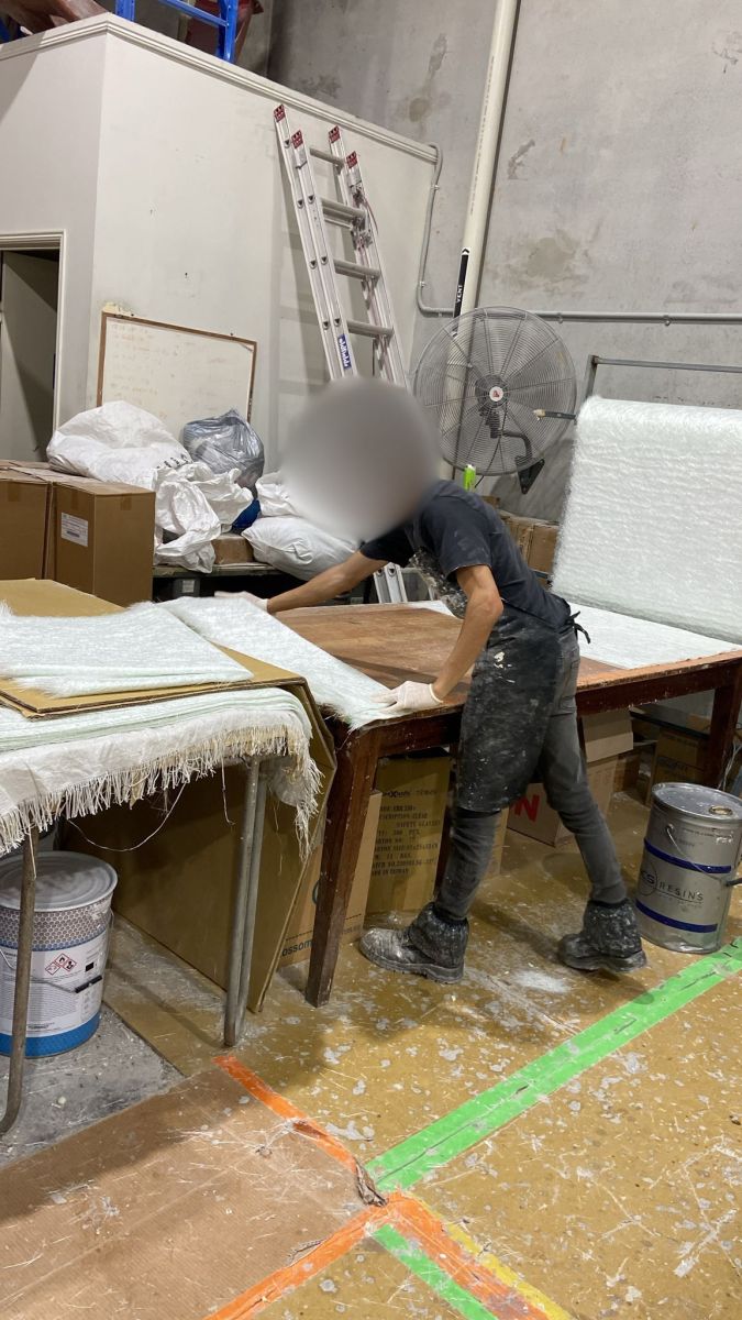 Hand-laying fibreglass at Monkey Warehouse Brisbane