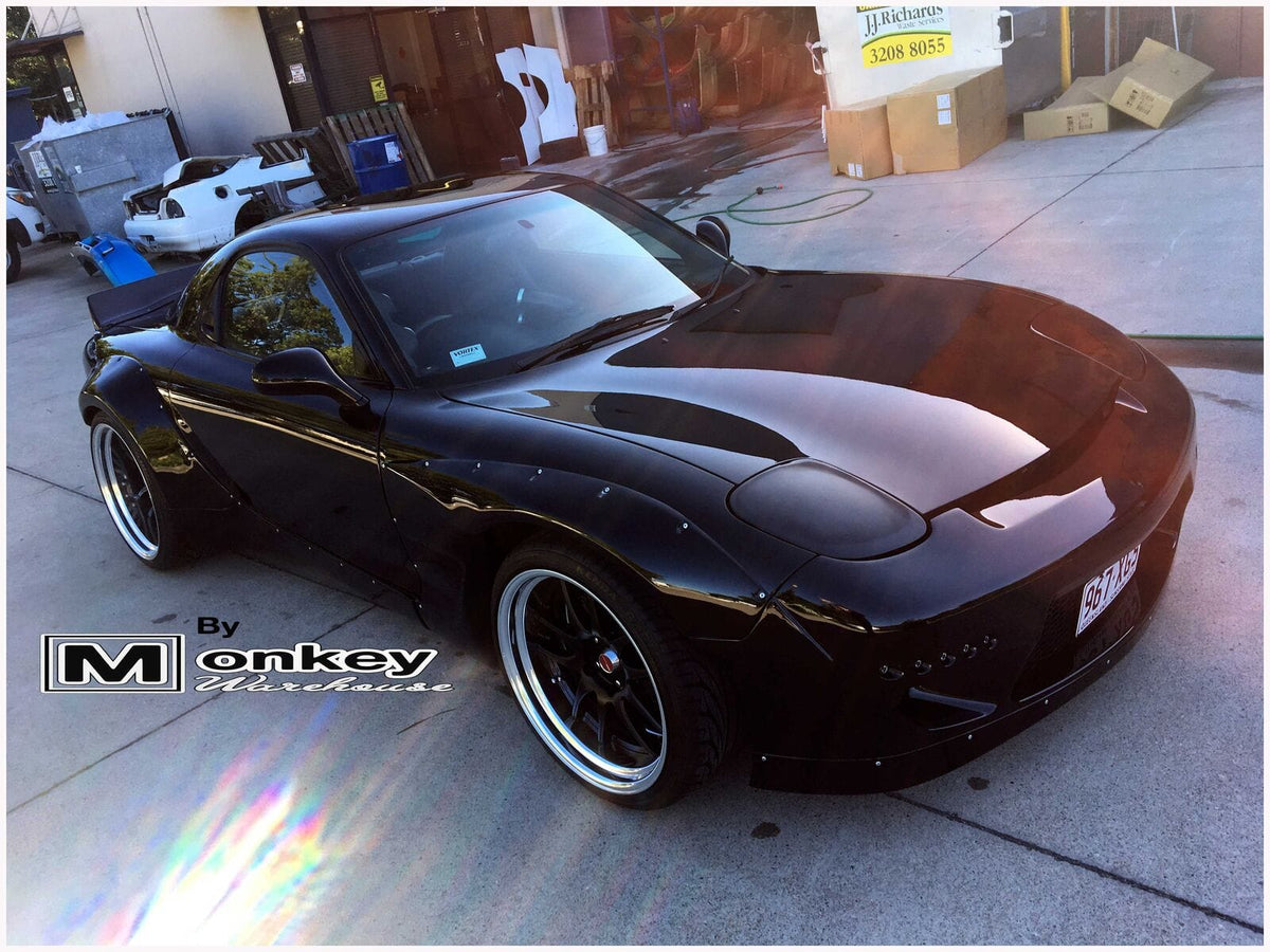 Installed View - Mazda RX7 FD: Rocket Bunny Style 4-Piece Guard & Flare Set