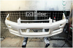 Installed View - Nissan Skyline R34: GTR Nur Spec Style Front Bumper